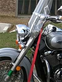 TIE THE STRAP DOWN AROUND THE HANDLEBAR